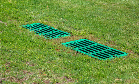 catch basin grate on a lawn - Big Easy Drainage