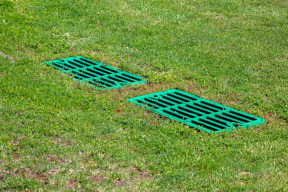 catch basin grate on a lawn